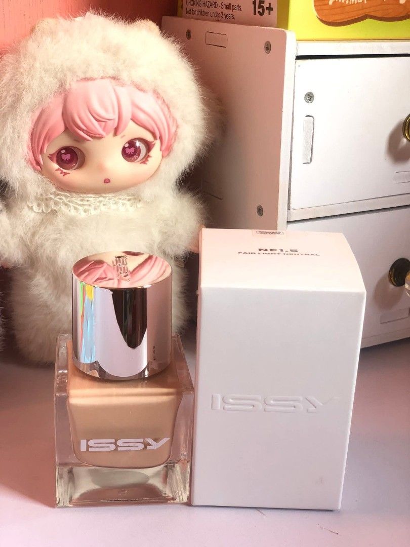 Issy & Co. Foundation NF1.5 (Category: Makeup) located in Tanza. Submitted by periwinkleeee.24 (Listing ID 1427936363, Image 1). Description: Issy & Co. foundation in a glass bottle with a silver cap. The product is in a square bottle with a beige foundation inside. The box is white with the brand name embossed on it. The product is new and unused..