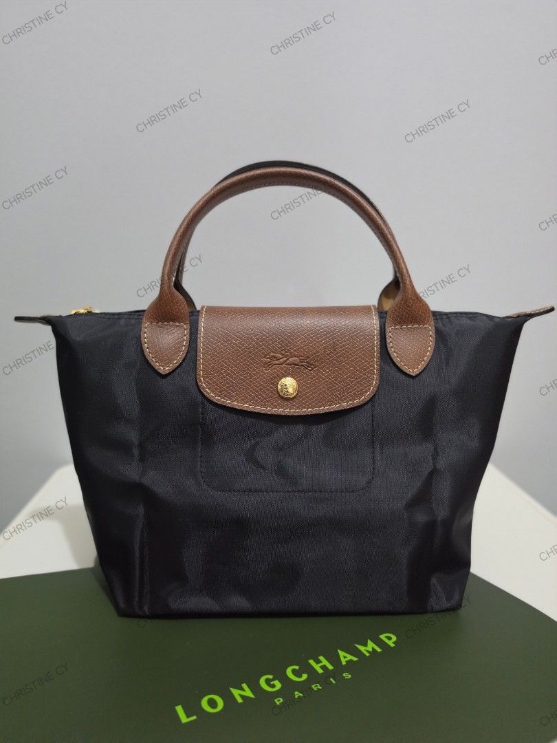 Longchamp le pliage small short handle (Category: Luxury Bags & Wallets) located in Bauang. Submitted by chictine (Listing ID 1427953902, Image 2). Description: Longchamp le pliage small short handle comes with replacement strap Page: must have shop by Christine All brandnew All guaranteed original or moneyback if proven fake ✅Open for layaway (1 month term) ✅Cop/Cod accepted with minimal dp 🚚Courier: Jnt/Lbc 📍Location: Bauang, La Union Open fo
