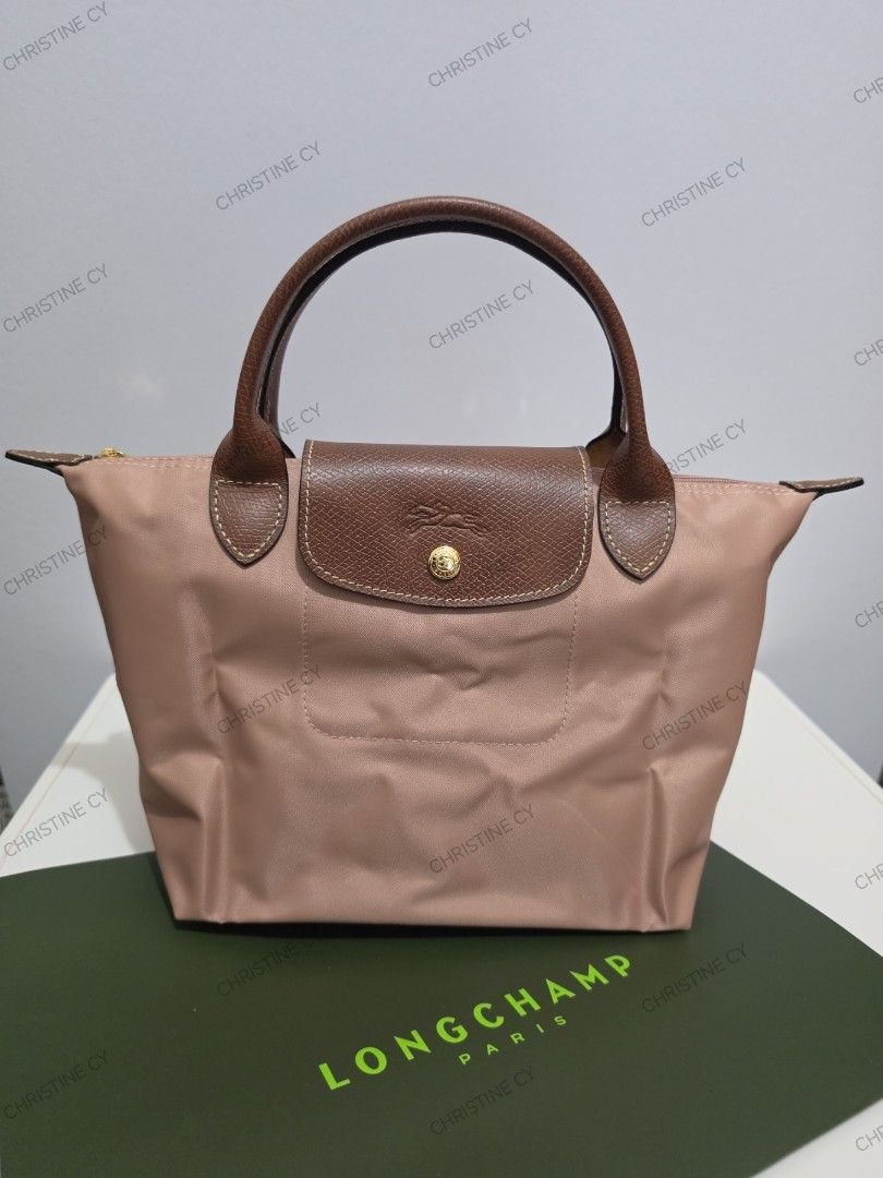 Longchamp le pliage small short handle (Category: Luxury Bags & Wallets) located in Bauang. Submitted by chictine (Listing ID 1427953902, Image 3). Description: Longchamp le pliage small short handle comes with replacement strap Page: must have shop by Christine All brandnew All guaranteed original or moneyback if proven fake ✅Open for layaway (1 month term) ✅Cop/Cod accepted with minimal dp 🚚Courier: Jnt/Lbc 📍Location: Bauang, La Union Open fo