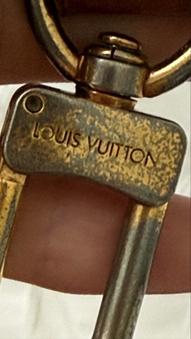 Louis Vuitton Bag Strap (Category: Luxury Bags & Wallets) located in Pasay City. Submitted by crc21 (Listing ID 1427973785, Image 3). Description: Authentic Louis Vuitton bag strap. Features brown leather with gold-tone hardware. The strap has visible signs of wear, including some cracking on the leather and wear on the hardware. The strap measures approximately 39cm in length. Includes the Louis Vuitton logo on the hardware and strap..