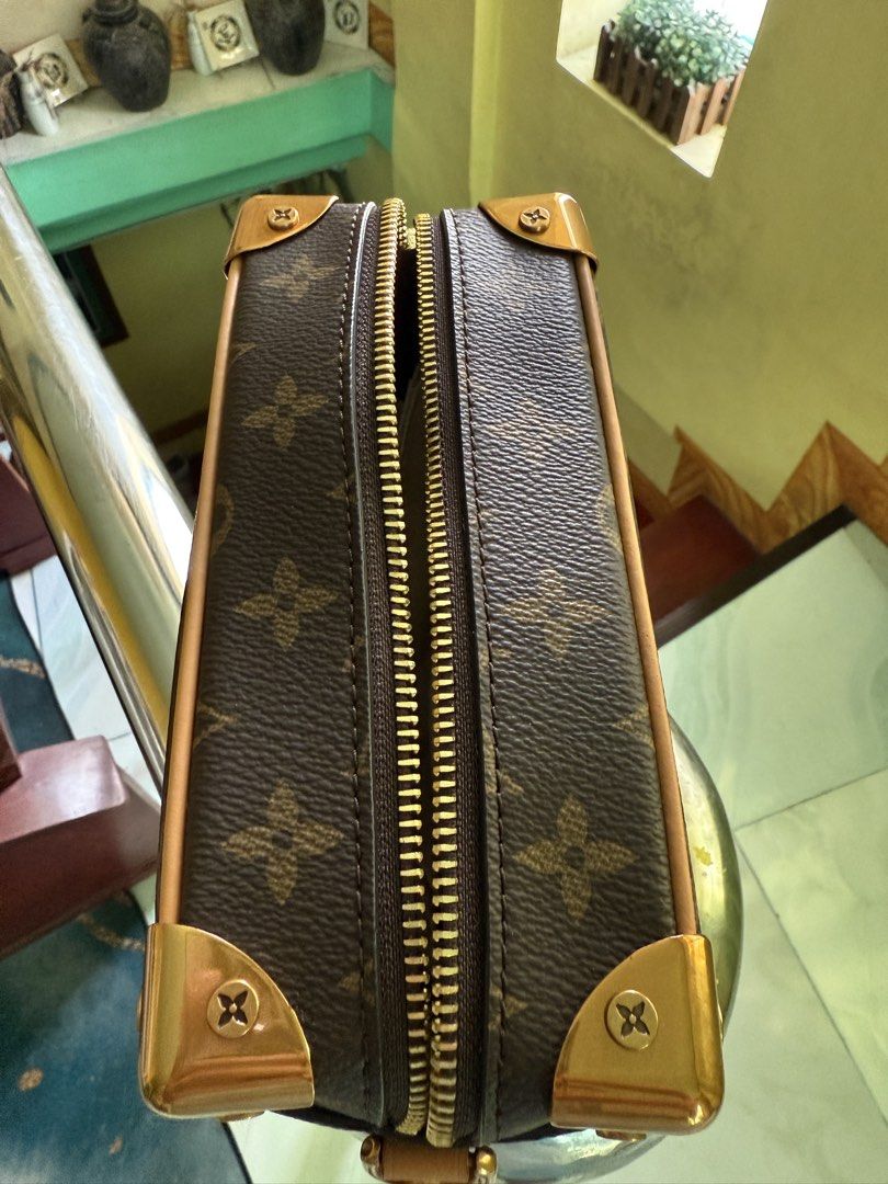Louis Vuitton Soft Trunk Monogram Crossbody bag (Category: Luxury Bags & Wallets) located in Cabuyao City. Submitted by gerlieluxurycloset2024 (Listing ID 1428010027, Image 3). Description: Louis Vuitton Petite Malle handbag. Features the iconic Monogram canvas, gold-tone hardware, and a chain strap. The interior includes a small pocket and a leather tag. Comes with a dust bag. The bag has a structured shape with a zip closure. Complete with dust