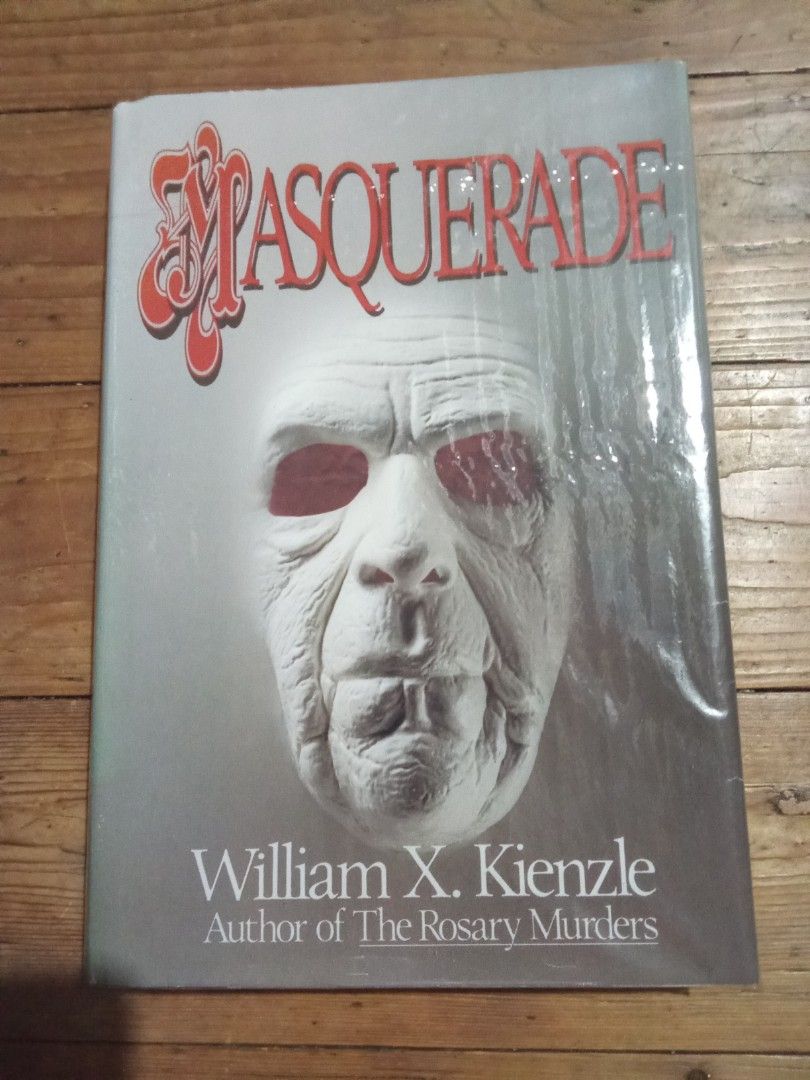 Masquerade by William Kienzle (Category: Storybooks) located in Pasig City. Submitted by teebeedeee (Listing ID 1428093611, Image 1). Description: - "Masquerade" by William Kienzle - Vintage mystery novel - Features intriguing cover art - Ideal for collectors and readers of thrillers preowned authentic hardcover book complete pages plastic covered.1990 book .pages have yellowed due to storage and no visible penmarks.with visible yellow stain sa l