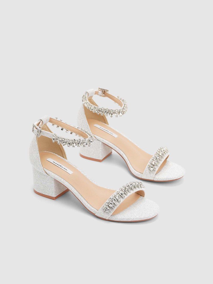 Matthews Embellished Block Heel Sandals (Category: Heels) located in Quezon City. Submitted by ceegeexx (Listing ID 1427960564, Image 1). Description: Matthews Bridal Shoes | ARIN 💎🤍 ✔️ Used once for ceremony only ✔️ Silver ✔️ Size 37 📸 Still looks perfect when worn ✨ No damage, only minimal footmarks (not visible when worn) Bought for ₱2000 ₱1100 (negotiable).