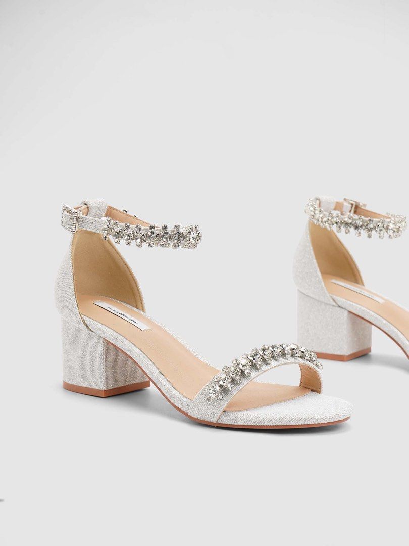 Matthews Embellished Block Heel Sandals (Category: Heels) located in Quezon City. Submitted by ceegeexx (Listing ID 1427960564, Image 2). Description: Matthews Bridal Shoes | ARIN 💎🤍 ✔️ Used once for ceremony only ✔️ Silver ✔️ Size 37 📸 Still looks perfect when worn ✨ No damage, only minimal footmarks (not visible when worn) Bought for ₱2000 ₱1100 (negotiable).