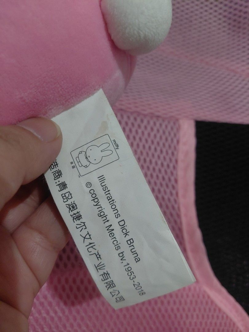 Miffy in Pink Plush Toy (Category: Plushies & Soft Toys) located in Manila. Submitted by bashamylove0116 (Listing ID 1427998185, Image 3). Description: Adorable Miffy Pink plush toy. Features a white bunny head with blue eyes and a pink body with a bow. The toy is soft and cuddly, perfect for kids or collectors. The tag indicates it's an official Miffy product. A cute and charming addition to any collection..