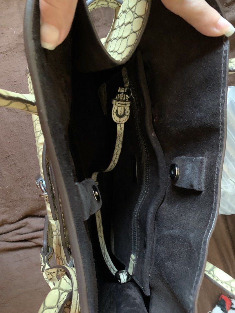 Miu Miu Crocodile-Embossed Leather (Category: Luxury Bags & Wallets) located in Makati City. Submitted by anamurillo (Listing ID 1428064981, Image 2). Description: Authentic bought in Miu Miu store in Italy With detachable pouch. Original dust bag included Length 28cm, width 42cm, gusset 15cm Handle 48cm Good condition but needs cleaning Negotiable for sure buyer only .