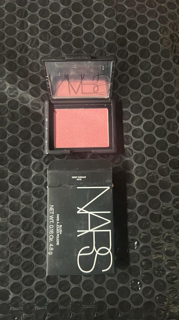 NARS Blush - Deep Throat (Category: Makeup) located in Makati City. Submitted by kozmetics (Listing ID 1427976042, Image 1). Description: NARS blush in the shade Deep Throat. The product is in a black compact with a mirror. The box is included. The net weight is 0.16 oz / 4.8 g. The blush is a pink shade. The box has the NARS logo and product information..