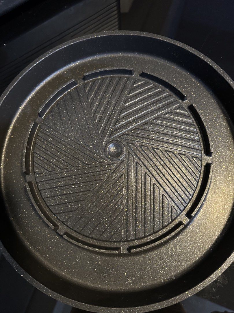 Non-Stick Korean BBQ Grill Pan (Category: Cookware & Accessories) located in Muntinlupa City. Submitted by rantila (Listing ID 1428080338, Image 2). Description: Non-stick grill pan is perfect for Korean BBQ. It features a unique design for even cooking and easy cleaning. The pan has a circular grilling surface with a central drainage area. It also has handles for easy handling. Enjoy delicious grilled food with this convenient pan. Diameter: 34 