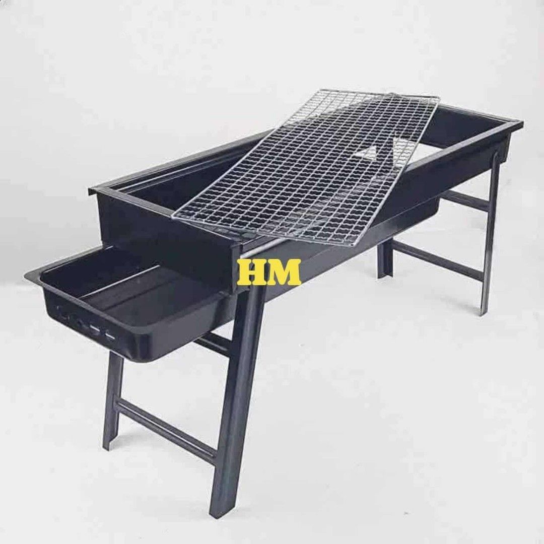 Portable Charcoal Barbecue Grill (Category: BBQ, Grills & Hotpots) located in Manila. Submitted by haideee (Listing ID 1428036009, Image 2). Description: Portable barbecue grill is perfect for outdoor cooking. It features a rectangular design with a grilling grate and a side tray. The grill has foldable legs for easy storage and transport. The grill also includes a removable ash tray for easy cleaning..