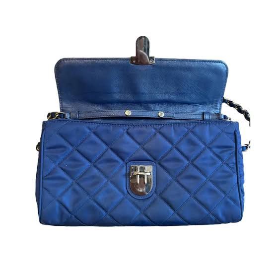 SALE! Prada Blue Quilted Nylon Crossbody Bag (Category: Luxury Bags & Wallets) located in Santa Rosa. Submitted by happydays__ (Listing ID 1428058440, Image 2). Description: Rare find! Prada Silver Chain Quilted Nylon Crossbody Guaranteed Authentic Got this from Madrid Really nice! Message me for more details Loc: Nuvali area Thanks .