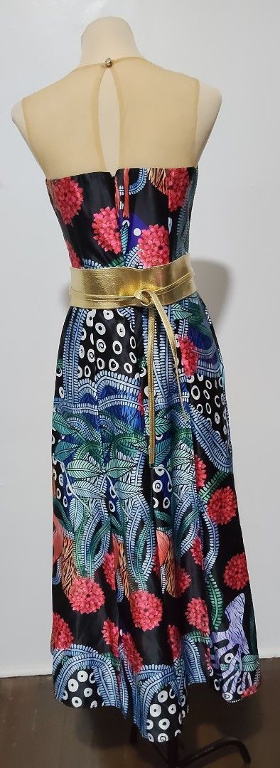 Printed Midi Dress with Belt (Category: Dresses) located in Manila. Submitted by audrey03 (Listing ID 1428078852, Image 1). Description: Elegant midi dress featuring a vibrant floral and abstract print. It has a strapless design with a sheer neckline and a fitted bodice. The dress includes a gold-colored belt to cinch the waist. The skirt flows down to a midi length, creating a flattering silhouette. Perfect for special occasions. SF c/o buyer.
