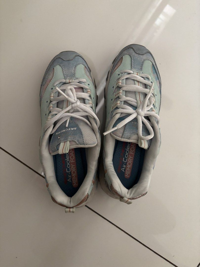 Skechers D'Lites Sneakers - US 7 (Category: Sneakers) located in Quezon City. Submitted by bingbnb (Listing ID 1428094783, Image 3). Description: Skechers D'Lites sneakers in a blue and gray colorway. Features Air-Cooled Memory Foam insoles. Size US 7, UK 4, EUR 37, 240 (LBM). The shoes have laces and a padded collar. The shoes have a light blue and gray color scheme..