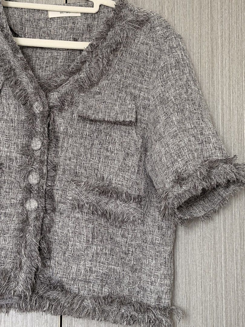 Tweed Jacket with Fringe Detail (Category: Coats, Jackets and Outerwear) located in Pasay City. Submitted by wuangel_ (Listing ID 1427963351, Image 2). Description: Tweed jacket features a classic design with a V-neck and short sleeves. It has a button-down closure and two front pockets. The jacket is accented with fringe detailing along the collar, pockets, and hem. It's a stylish piece that can elevate any outfit..