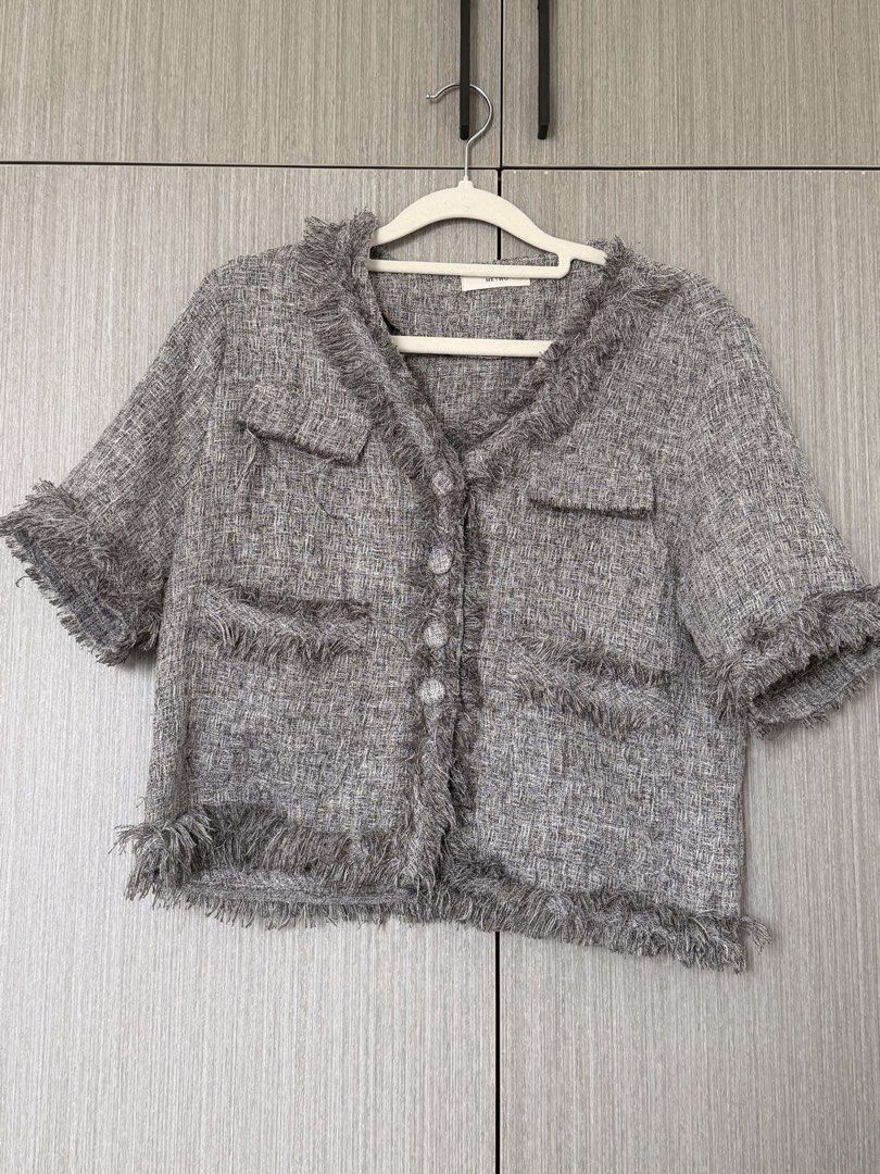 Tweed Jacket with Fringe Detail (Category: Coats, Jackets and Outerwear) located in Pasay City. Submitted by wuangel_ (Listing ID 1427963351, Image 1). Description: Tweed jacket features a classic design with a V-neck and short sleeves. It has a button-down closure and two front pockets. The jacket is accented with fringe detailing along the collar, pockets, and hem. It's a stylish piece that can elevate any outfit..