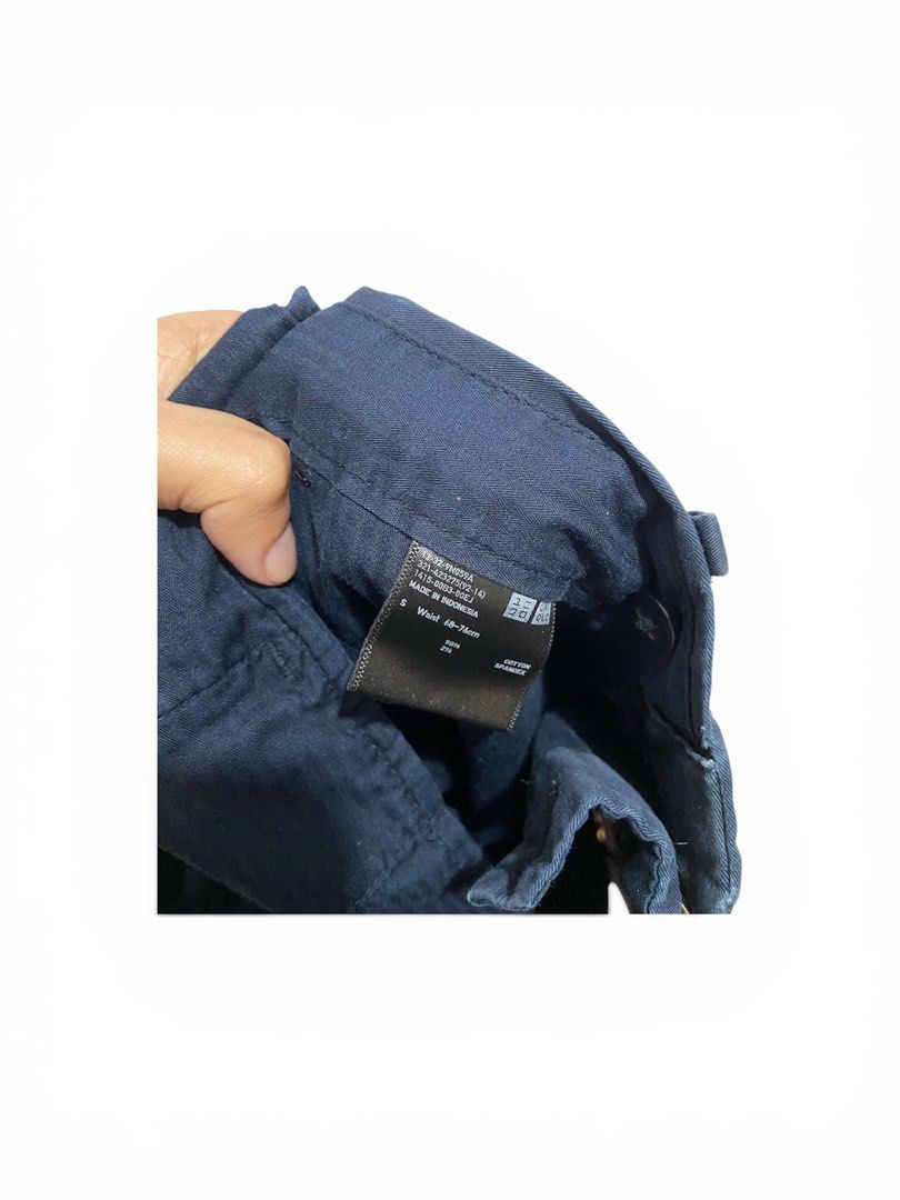 Uniqlo Navy Shorts - Size S (Category: Shorts) located in Manila. Submitted by wanderboy_01 (Listing ID 1427985902, Image 2). Description: Navy shorts from Uniqlo. The size is S, with a waist size of 68-76cm. Features a classic design with two front pockets and two back pockets. Made from a durable fabric suitable for everyday wear. Perfect for casual outings or relaxed days..