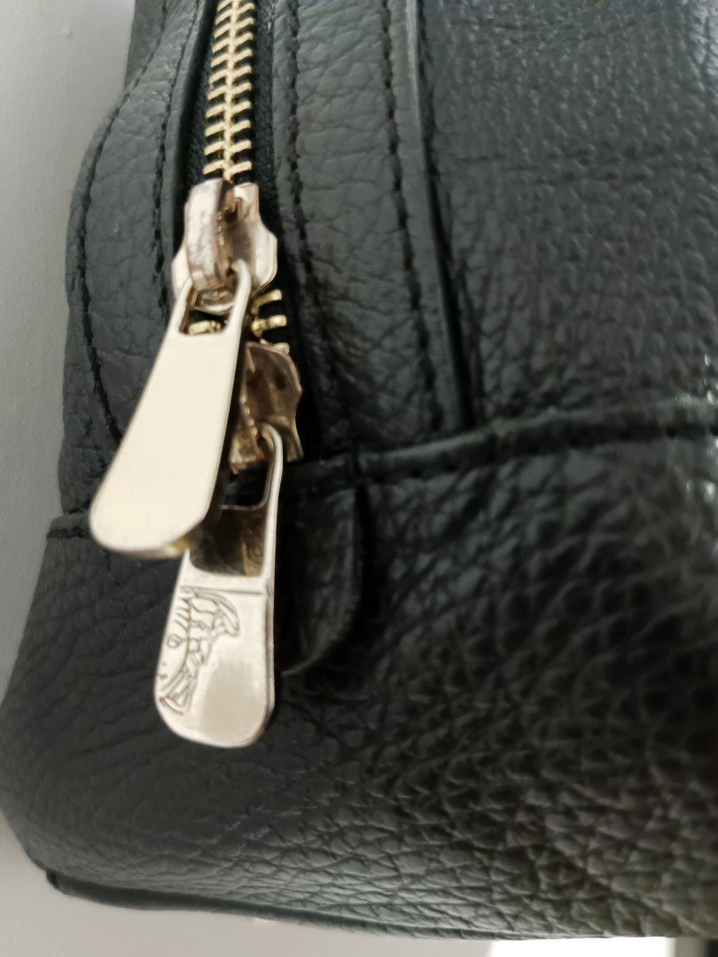 Versace Collection Black Pebbled leather shoulder Bag (Category: Luxury Bags & Wallets) located in Cotabato. Submitted by silvervintage77 (Listing ID 1427995026, Image 3). Description: Authentic Versace Collection Black Pebbled leather shoulder Bag excellent 10/10 color rate Size 14 Width X 9 Length -Bag has double zip top closure w/ Gold tone medusa zipper pulls -The exterior has pebbled leather finish and Versace Gold tone Plaque on front -The 