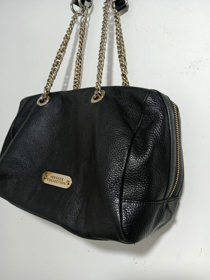 Versace Collection Black Pebbled leather shoulder Bag (Category: Luxury Bags & Wallets) located in Cotabato. Submitted by silvervintage77 (Listing ID 1427995026, Image 2). Description: Authentic Versace Collection Black Pebbled leather shoulder Bag excellent 10/10 color rate Size 14 Width X 9 Length -Bag has double zip top closure w/ Gold tone medusa zipper pulls -The exterior has pebbled leather finish and Versace Gold tone Plaque on front -The 
