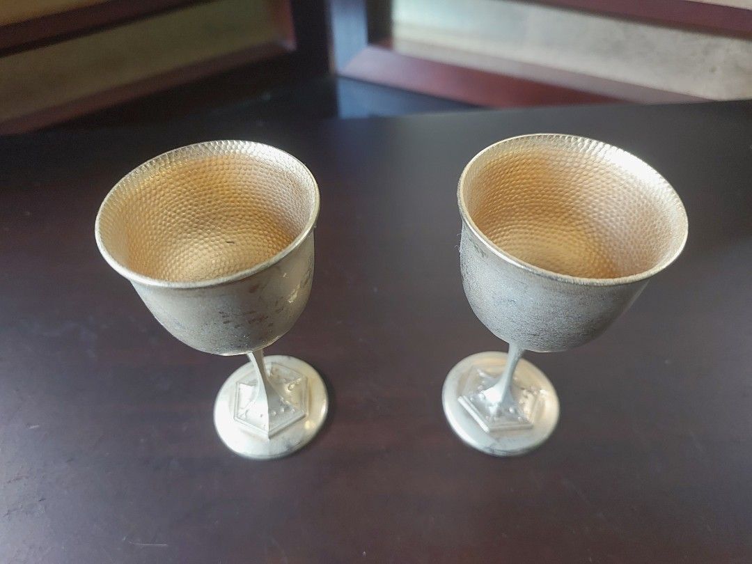 Vintage Japanese Sake Cups (Category: Coffee & Tea Tableware) located in Bulacan. Submitted by hnbfinds (Listing ID 1427947203, Image 2). Description: Vintage Japanese 24K gold-plated (24KGP) sake cups or goblets. Key Identification Features Material: They are typically gold-plated over a base metal, often indicated by a "24KGP" hallmark on the bottom of the base. Design: These goblets feature a distinctive hammered texture on the interior of the