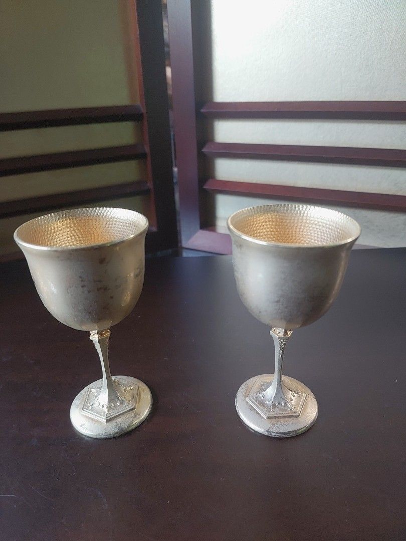 Vintage Japanese Sake Cups (Category: Coffee & Tea Tableware) located in Bulacan. Submitted by hnbfinds (Listing ID 1427947203, Image 1). Description: Vintage Japanese 24K gold-plated (24KGP) sake cups or goblets. Key Identification Features Material: They are typically gold-plated over a base metal, often indicated by a "24KGP" hallmark on the bottom of the base. Design: These goblets feature a distinctive hammered texture on the interior of the