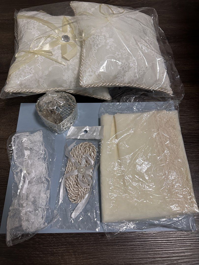 Wedding Ceremony Accessories Unused (Category: Everything Else Others) located in Quezon City. Submitted by _anythingforless_ (Listing ID 1427947360, Image 1). Description: Never Used Ceremony Accessories 2 pillows Arrhae coins and holder Cord Veil With free robe & garter Shipping from Fairview, QC.