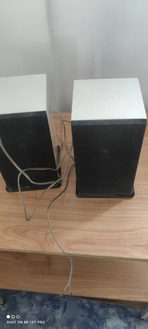 White and Black Speakers (Category: Soundbars, Speakers & Amplifiers) located in Cavite. Submitted by Combiishop (Listing ID 1427952598, Image 1). Description: Pair of speakers with a white top and black front. Includes attached wires. The speakers are rectangular in shape. They are designed to sit upright. The speakers are suitable for use with a variety of audio devices..