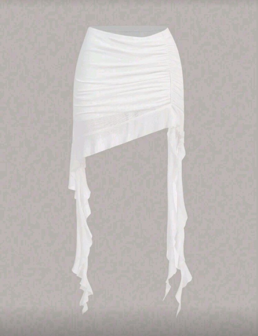 White Ruffled Asymmetrical Hem Skirt (with shorts) (Category: Skirts) located in Manila. Submitted by monaaa03 (Listing ID 1428089309, Image 1). Description: White mini skirt with a unique ruffled design. Features an asymmetrical hemline with long, flowing fabric strips. The skirt has a ruched detail on one side, adding texture and visual interest. Made of a lightweight, possibly sheer fabric. Perfect for a stylish and feminine look..