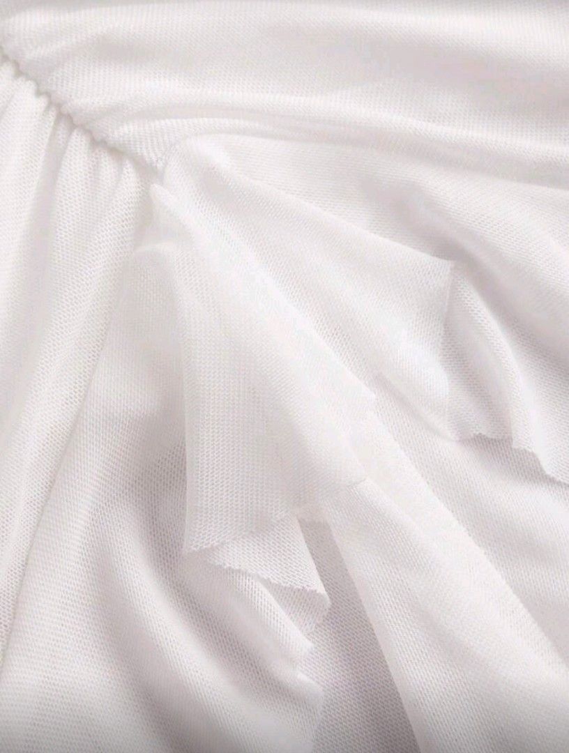 White Ruffled Asymmetrical Hem Skirt (with shorts) (Category: Skirts) located in Manila. Submitted by monaaa03 (Listing ID 1428089309, Image 3). Description: White mini skirt with a unique ruffled design. Features an asymmetrical hemline with long, flowing fabric strips. The skirt has a ruched detail on one side, adding texture and visual interest. Made of a lightweight, possibly sheer fabric. Perfect for a stylish and feminine look..