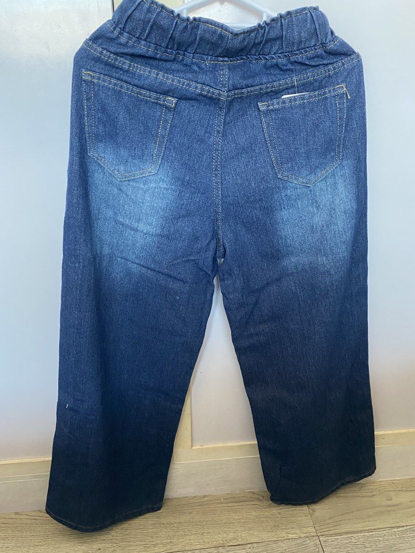 Woman Denim Jeans (Category: Jeans) located in Cavite. Submitted by jmbcollections (Listing ID 1427942955, Image 3). Description: These denim jeans feature an elastic waistband with a drawstring. They have two front pockets and two back pockets. The jeans are a dark blue wash. The waist measures approximately 31 inches, and the length is about 36 inches..