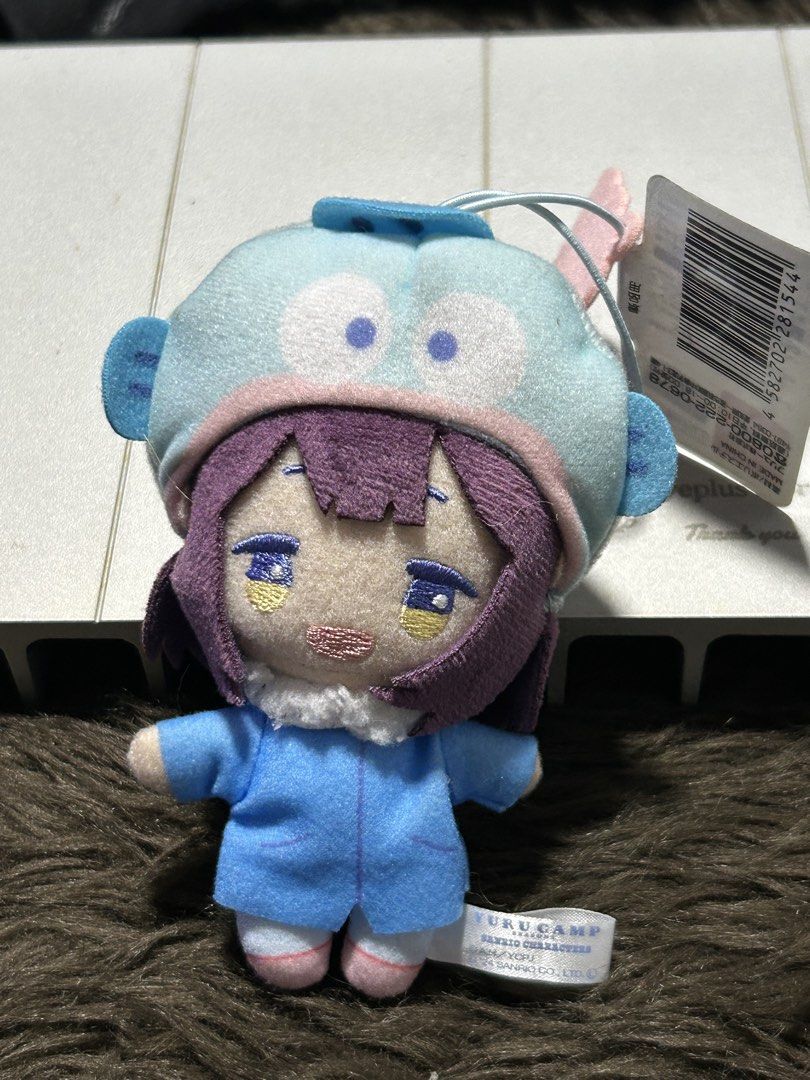 Yuru Camp Nadeshiko Plush Keychain (Category: Plushies & Soft Toys) located in Angeles City. Submitted by zyeplustradings (Listing ID 1428080045, Image 1). Description: Adorable Nadeshiko plush keychain from Yuru Camp is perfect for fans! It features Nadeshiko in her winter outfit with a cute hat. The plushie has a keychain loop, making it easy to attach to your bag or keys. It has a tag attached. Made with soft materials, this plushie is a great