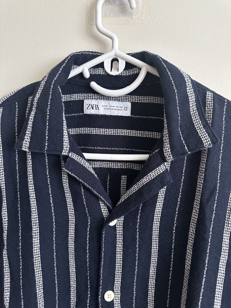 Zara Striped Short Sleeve Shirt (Category: Tshirts & Polo Shirts ) located in Manila. Submitted by peebss18 (Listing ID 1428067704, Image 1). Description: Zara Striped Short Sleeve Shirt (Men M) Condition: Good / lightly used Size: Medium (fits M comfortably) Dimensions: L – 27” / W – 22.5” Details: • Premium Zara shirt with classic striped design • Soft and breathable cotton / cotton-blend material • Stylish for casual or semi-casual outfits • P