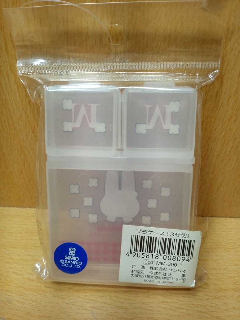 1990's My Melody 3-Compartment mini Storage Box (Category: Storage Boxes & Baskets) located in Davao. Submitted by washerjeni08452 (Listing ID 1428223170, Image 2). Description: My Melody storage box features a 3-compartment design. The top section has two compartments with the letter "M" on the lids. The bottom section showcases My Melody with a red and white checkered pattern. It is a Sanrio product, made in Japan. For San Rio collectors mint c