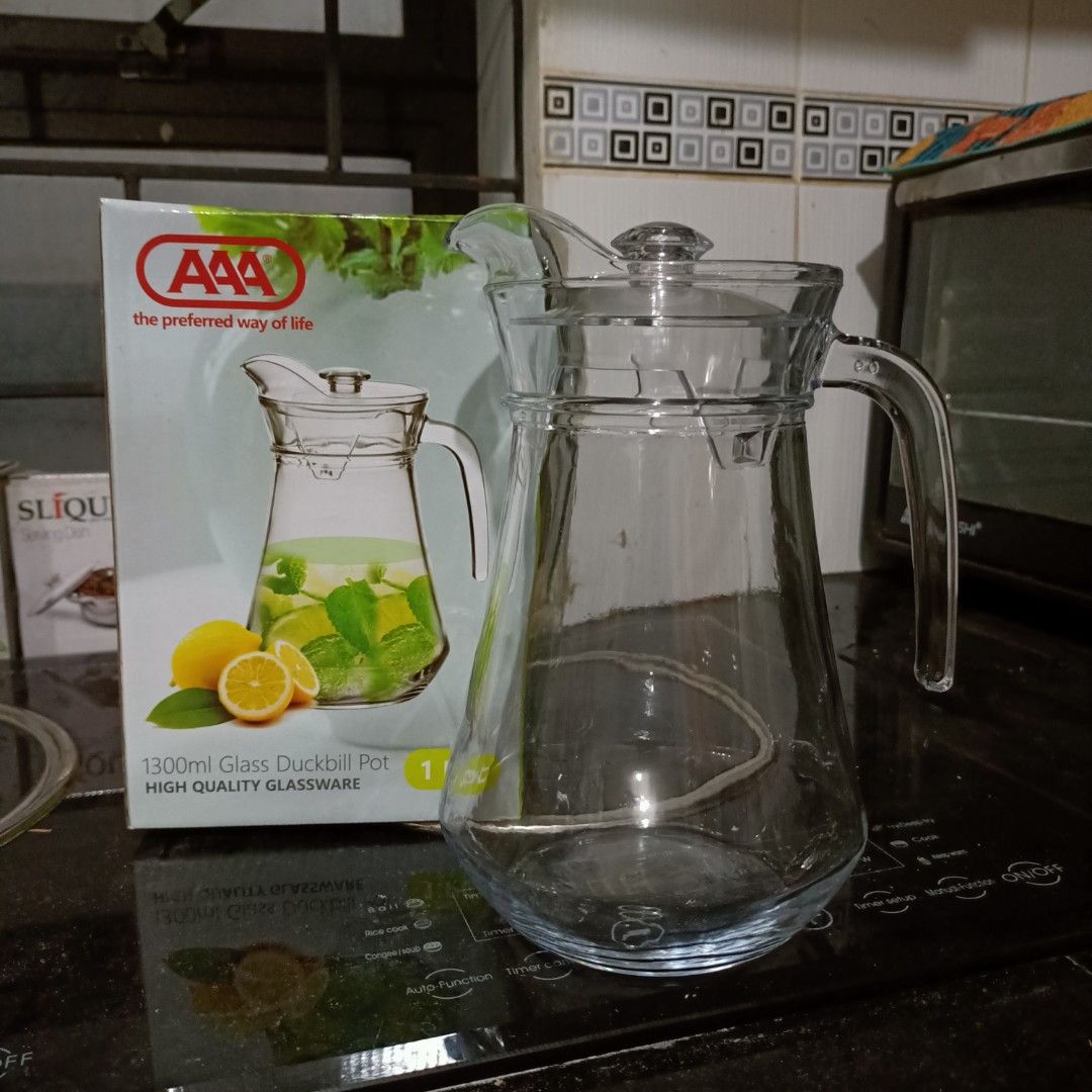AAA 1300ml Glass Duckbill Pot (Category: Pitchers & Dispensers) located in Makati City. Submitted by crstnemrise (Listing ID 1428183651, Image 2). Description: 1300ml glass duckbill pot from AAA. It is made of high-quality glassware. The pitcher comes with a lid and a handle for easy pouring. It is perfect for serving cold beverages like juice, iced tea, or infused water. The box indicates it is a single piece..
