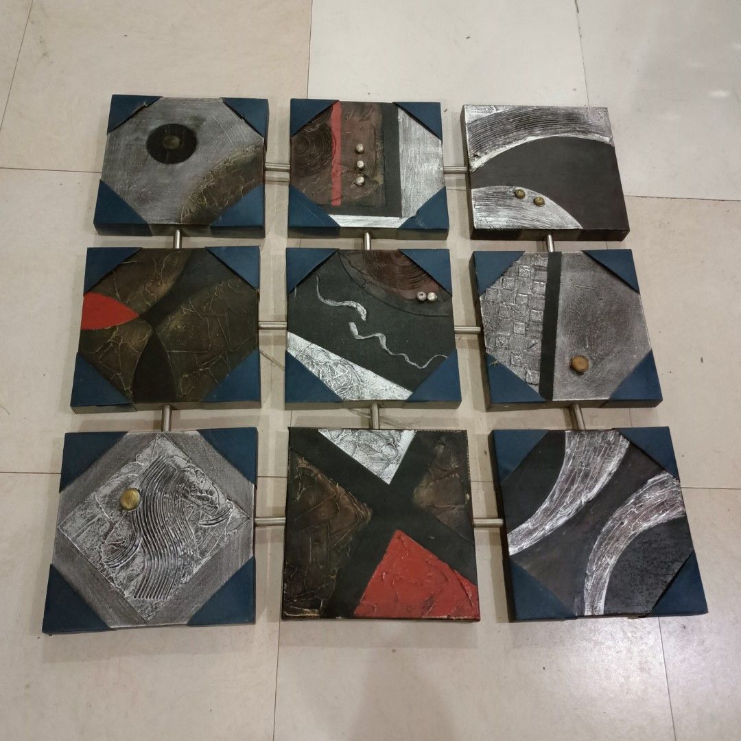 Abstract Square Wall Art (Category: Wall Decor) located in Makati City. Submitted by crstnemrise (Listing ID 1428119406, Image 1). Description: Unique abstract wall art featuring nine square panels. Each panel has a different design with a mix of colors, textures, and metallic accents. The panels are connected by metal rods, creating a cohesive and modern look. Perfect for adding a touch of artistic flair to any room. •Collapsible Painting •Orig.