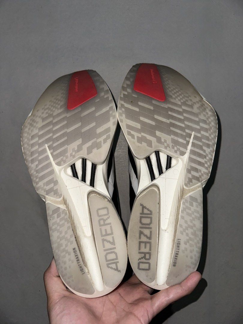 Adidas Adios Pro 4 ( size 10.5 US) with receipt (Category: Sneakers) located in Binan City. Submitted by brightspear (Listing ID 1428179015, Image 2). Description: Key Specs: • Size: 10.5 US / 10 UK / 44 2/3 FR / 28.5 CM • Colorway: Cloud White / Core Black / Solar Red • Mileage: 16km (used once only) • Condition: 9.5/10 (no box) • Authenticity: 100% Genuine. Bought month february 28, 2026 (Art No. JR1094). RFS: Switching to ASICS (Metaspeed seri