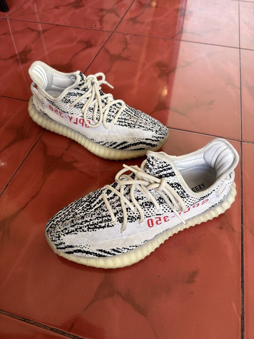 Adidas Yeezy Boost 350 V2 Zebra (Category: Sneakers) located in Quezon City. Submitted by sulitselections (Listing ID 1428173648, Image 1). Description: Pre-Loved, managed expectations. ORIGINAL AUTHENTIC GENUINE Fixed Price Location: Project 8 QC Near Mindanao Ave cor Road 20 Pick up via Lalamove. Buyer to book and shoulder shipping fee. RFS: Decluttering .