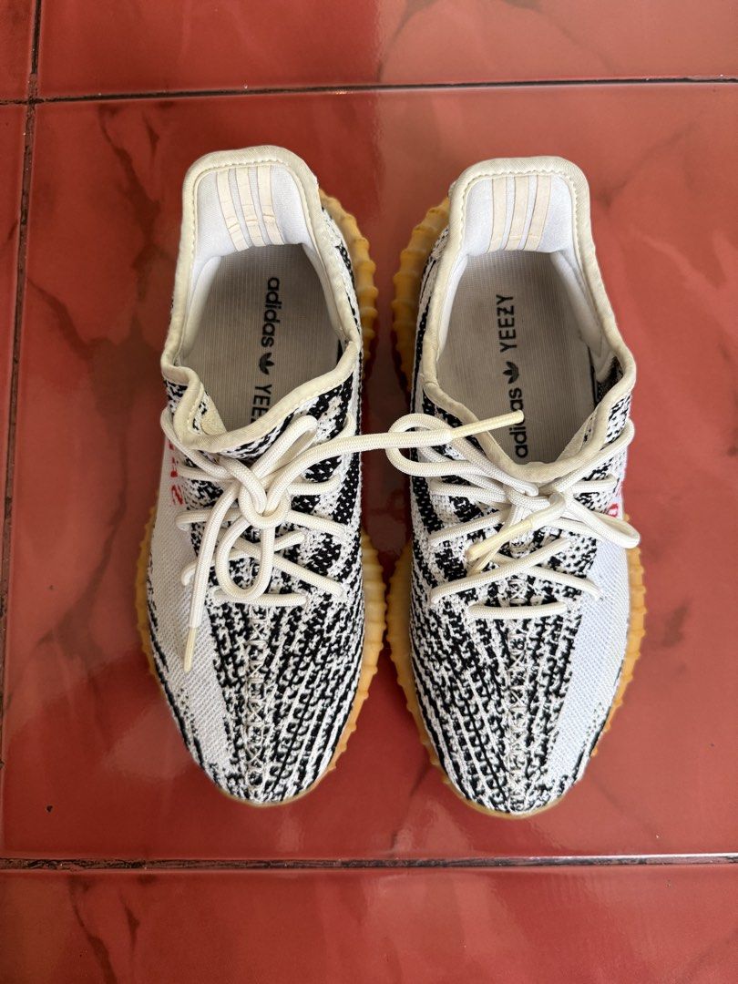 Adidas Yeezy Boost 350 V2 Zebra (Category: Sneakers) located in Quezon City. Submitted by sulitselections (Listing ID 1428174182, Image 2). Description: Pre-Loved, managed expectations. ORIGINAL AUTHENTIC GENUINE Fixed Price Location: Project 8 QC Near Mindanao Ave cor Road 20 Pick up via Lalamove. Buyer to book and shoulder shipping fee. RFS: Decluttering .