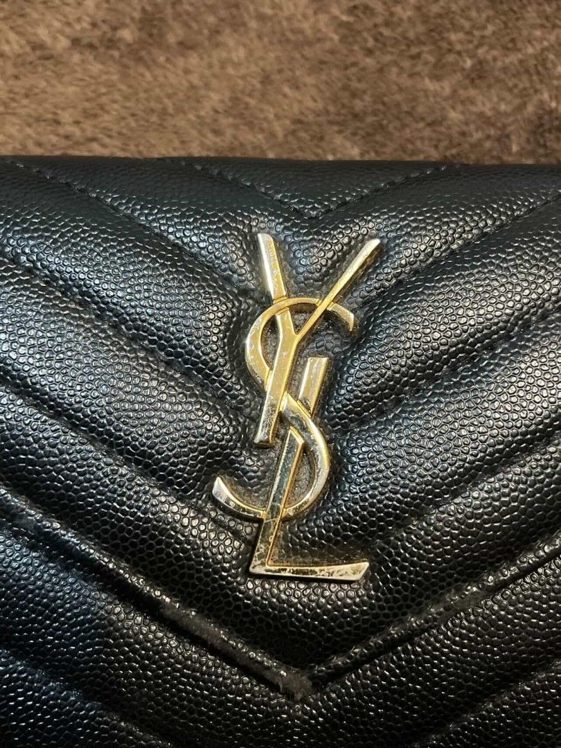 Authentic Saint Laurent Monogram Compact Short Trifold Wallet (Category: Luxury Bags & Wallets) located in Manila. Submitted by tonsofdeclutter (Listing ID 1428229704, Image 2). Description: Condition: 8/10 Bought it from Saint Laurent, Dubai Mall UAE Issues: Gold YSL logo scratches and chipped paint, side portion of wallet chipped (needs restoration only), and signs of usage. No box and misplaced authenticity card. LEGIT CHECK ALL YOU WANT.