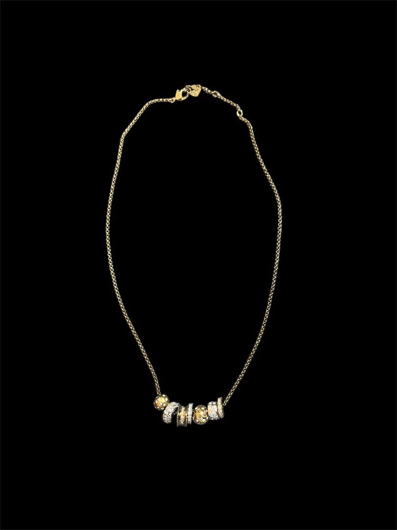 Authentic Swarovski Necklace with gemstones (Category: Necklaces) located in Pasig City. Submitted by mygoodstuff123 (Listing ID 1428195795, Image 1). Description: Elegant gold necklace featuring a delicate chain and a series of gemstone accents. The necklace has a secure clasp. The overall aesthetic is sophisticated and suitable for various occasions..