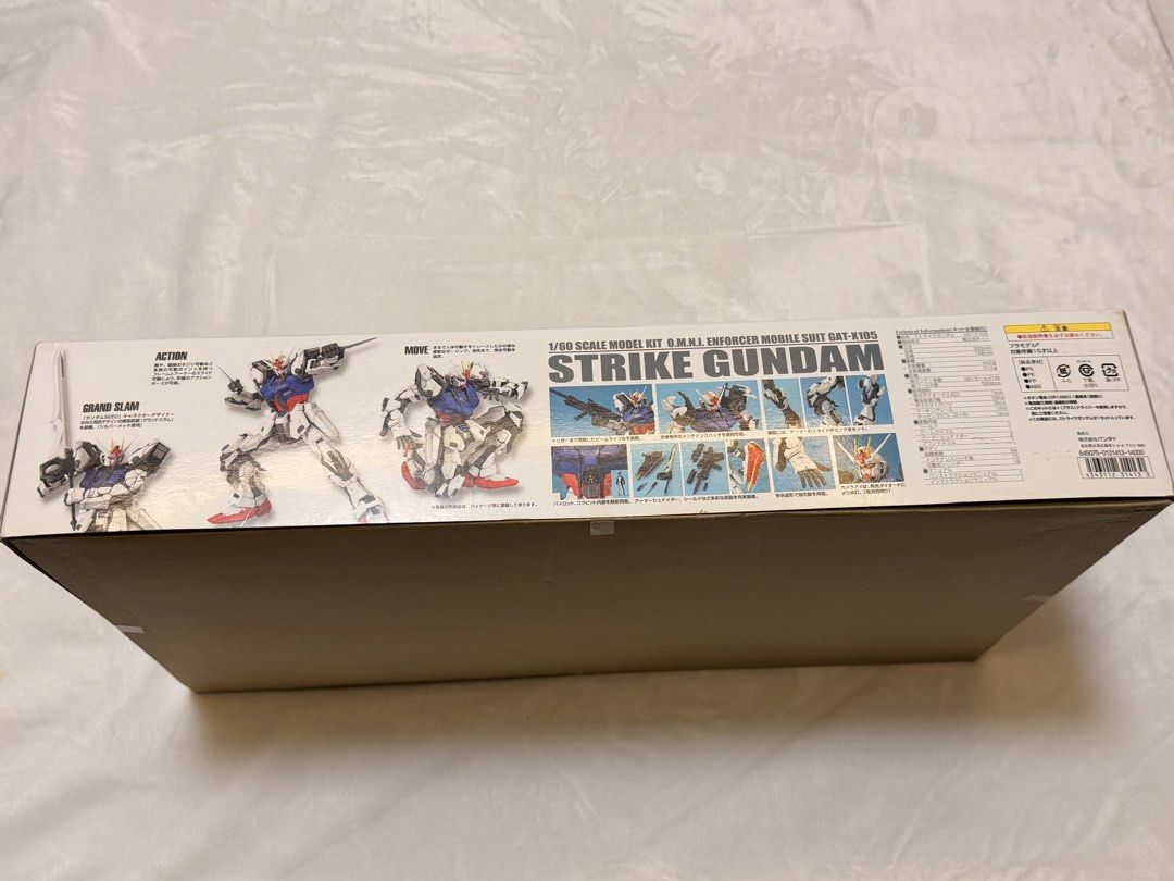 Bandai Perfect Grade Strike Gundam Model Kit (Category: Gundam & Model Kits) located in Pasig City. Submitted by donmsamson (Listing ID 1428229944, Image 2). Description: 1/60 scale model kit of the GAT-X105 Strike Gundam. The box features the Strike Gundam in a dynamic pose. It is a Perfect Grade model kit from Bandai. The box also shows different action poses and details of the model. The kit includes various accessories and weapons..