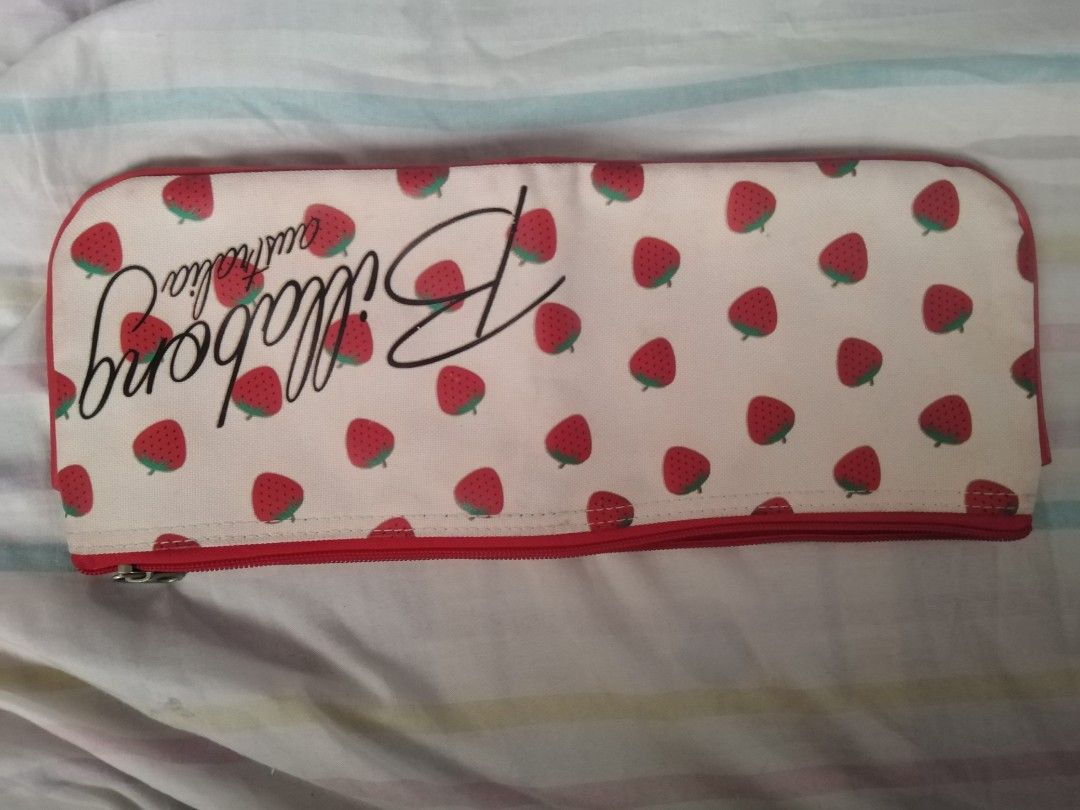 Billabong Strawberry Pencil long case (Category: Cases & Sleeves) located in Manila. Submitted by issabakikay (Listing ID 1428100094, Image 1). Description: Billabong pencil case features a vibrant strawberry print on a white background. It has a red zipper and a red interior. Inside, there is a small pocket for organizing smaller items..
