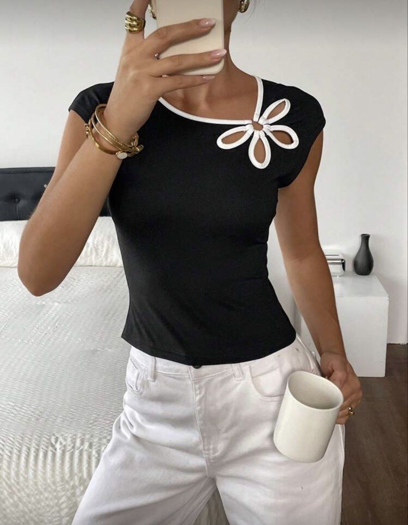 Black Flower Cutout Top (Category: Sleeveless) located in Manila. Submitted by dclutterrrr (Listing ID 1428103958, Image 1). Description: .