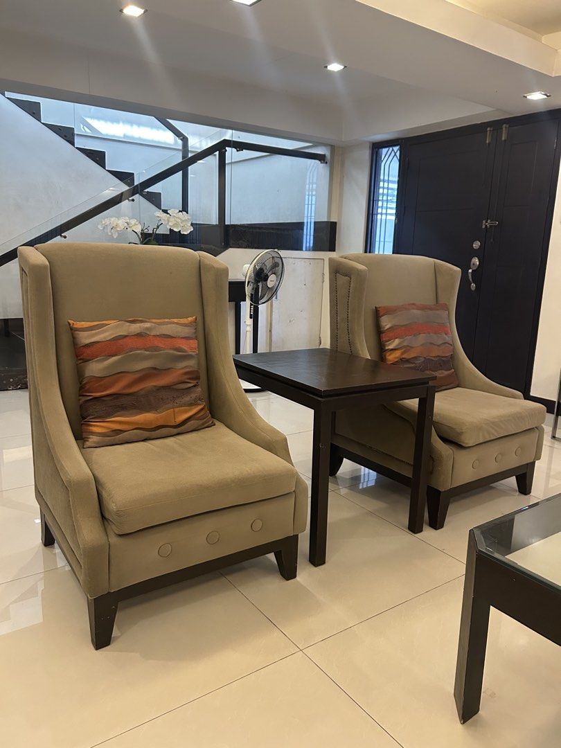 Brown Beige Wingback Armchairs Accent Chair with Side Table Set (Category: Chairs) located in Manila. Submitted by jmcl.declutters (Listing ID 1428179174, Image 2). Description: Custom-made light brown-beige wingback armchairs with dark coffee brown table. Chair legs are wooden (same dark wood material as table). Selling chair for Php8,500 each and table for Php1,500 Get all for Php15,000 only!.