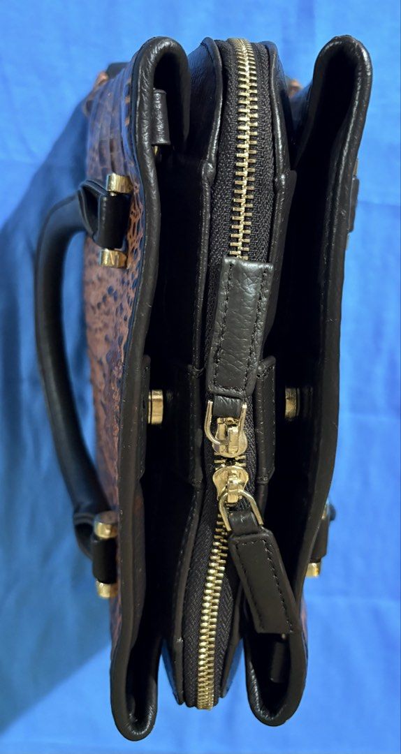 SALE Brown Crocodile-Embossed Handbag (Category: Tote Bags) located in Manila. Submitted by truedeclutter (Listing ID 1428128726, Image 3). Description: Dimensions L 31 cm W 12 cm H 25 cm Genuine leather, crocodile embossed No major visible flaws.