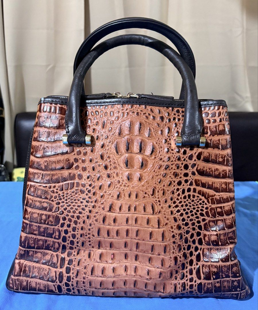 SALE Brown Crocodile-Embossed Handbag (Category: Tote Bags) located in Manila. Submitted by truedeclutter (Listing ID 1428128726, Image 1). Description: Dimensions L 31 cm W 12 cm H 25 cm Genuine leather, crocodile embossed No major visible flaws.