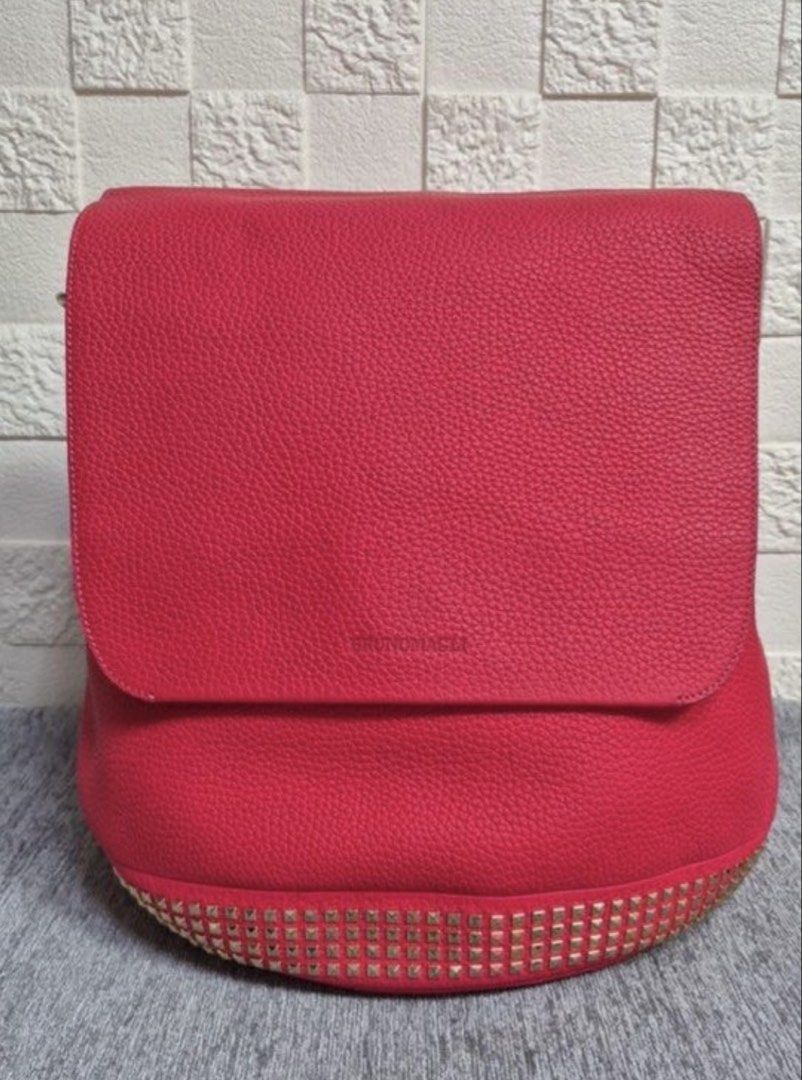 Bruno Magli Red Studded Backpack (Category: Backpacks) located in Manila. Submitted by alginialazo (Listing ID 1427941565, Image 1). Description: ❤️ Elegant Red Shoulder Bag Stylish, classy, and perfect for everyday use. Good condition. Message me if interested..