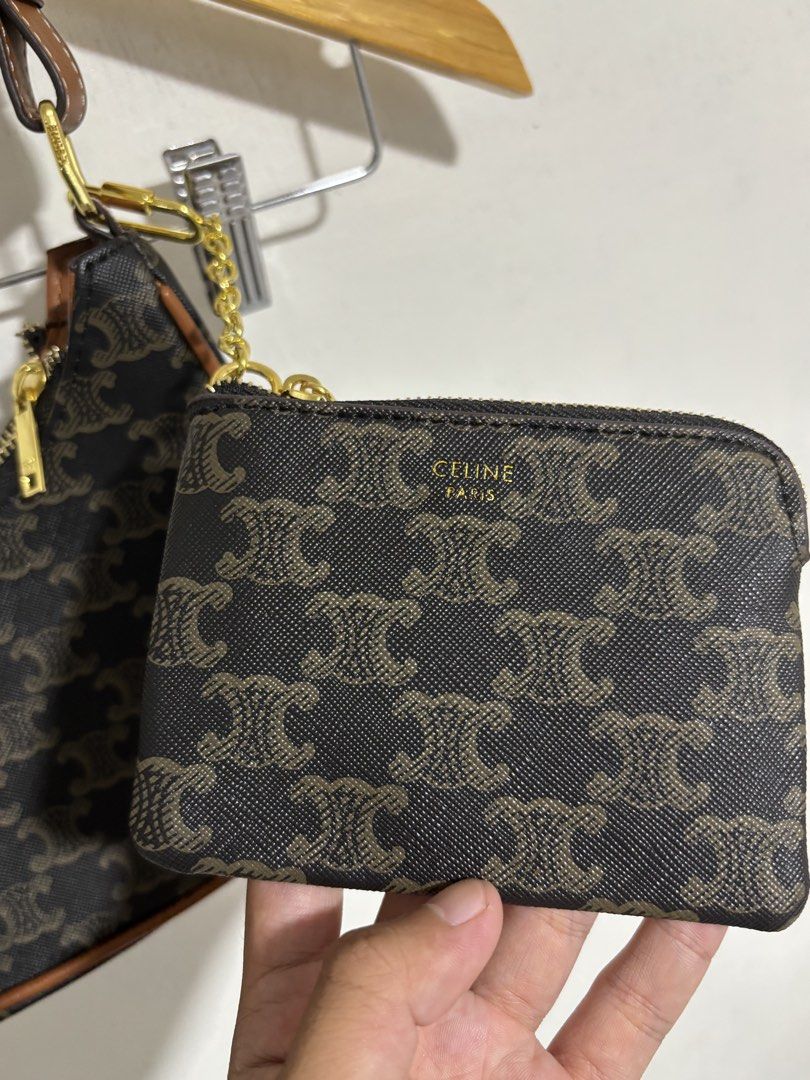 Celine Triomphe Shoulder Bag with Coin Purse (Category: Luxury Bags & Wallets) located in Naga. Submitted by unknwnstreetwear (Listing ID 1428193983, Image 3). Description: No issue Shoulder bag Width- 10 inches Length-7 inches Coin purse Width-5 inches Length-4 inches Celine Triomphe shoulder bag features the iconic Triomphe print. It comes with a matching coin purse. The bag has a brown leather strap and trim, with gold-tone hardware. The zippe