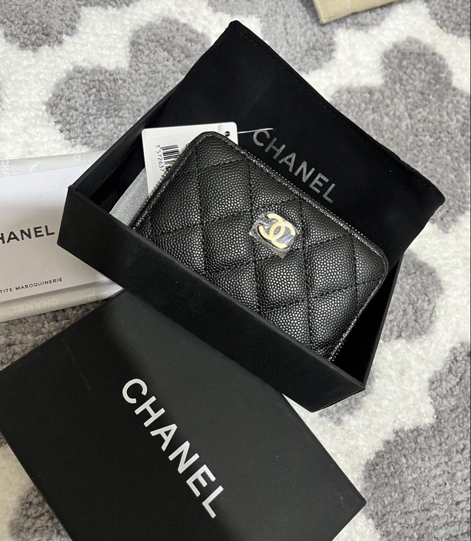 Chanel Quilted Zip Wallet (Category: Luxury Bags & Wallets) located in Mandaluyong City. Submitted by heyjazzzie (Listing ID 1428214988, Image 2). Description: CHANEL QUILTED ZIPPED CARDPURSE/SMALL WALLET in Classic Colorway Black Caviar Leather GHW (PREMIUM) Unused & In excellent condition. Rank 10 Comes with complete inclusions ~ box, dustbag, tags, booklet PRICE: 2,899 Japan sourced WITH CODE RFS: will buy a diff style kasi hindi kasya yung ca