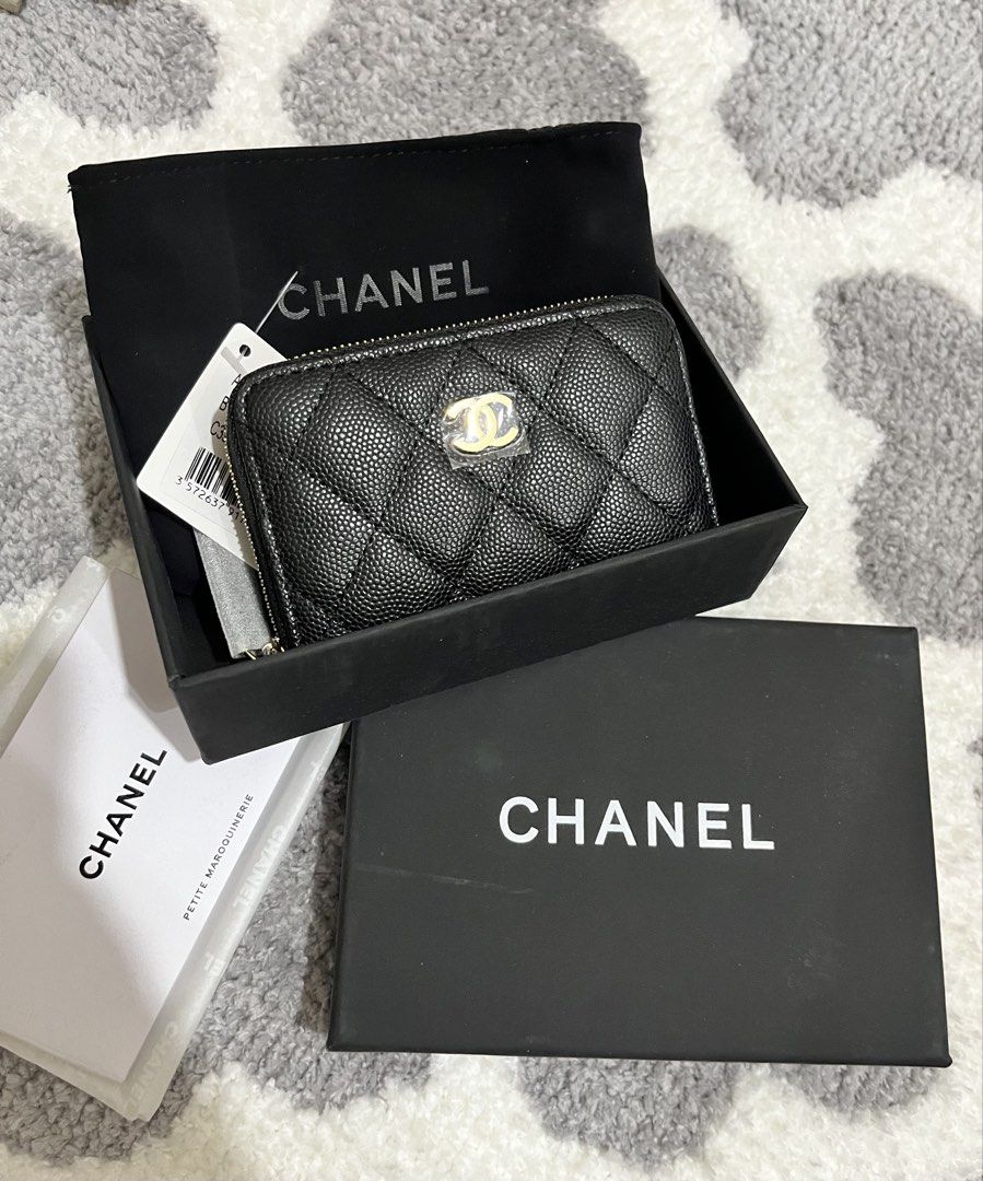 Chanel Quilted Zip Wallet (Category: Luxury Bags & Wallets) located in Mandaluyong City. Submitted by heyjazzzie (Listing ID 1428214988, Image 1). Description: CHANEL QUILTED ZIPPED CARDPURSE/SMALL WALLET in Classic Colorway Black Caviar Leather GHW (PREMIUM) Unused & In excellent condition. Rank 10 Comes with complete inclusions ~ box, dustbag, tags, booklet PRICE: 2,899 Japan sourced WITH CODE RFS: will buy a diff style kasi hindi kasya yung ca