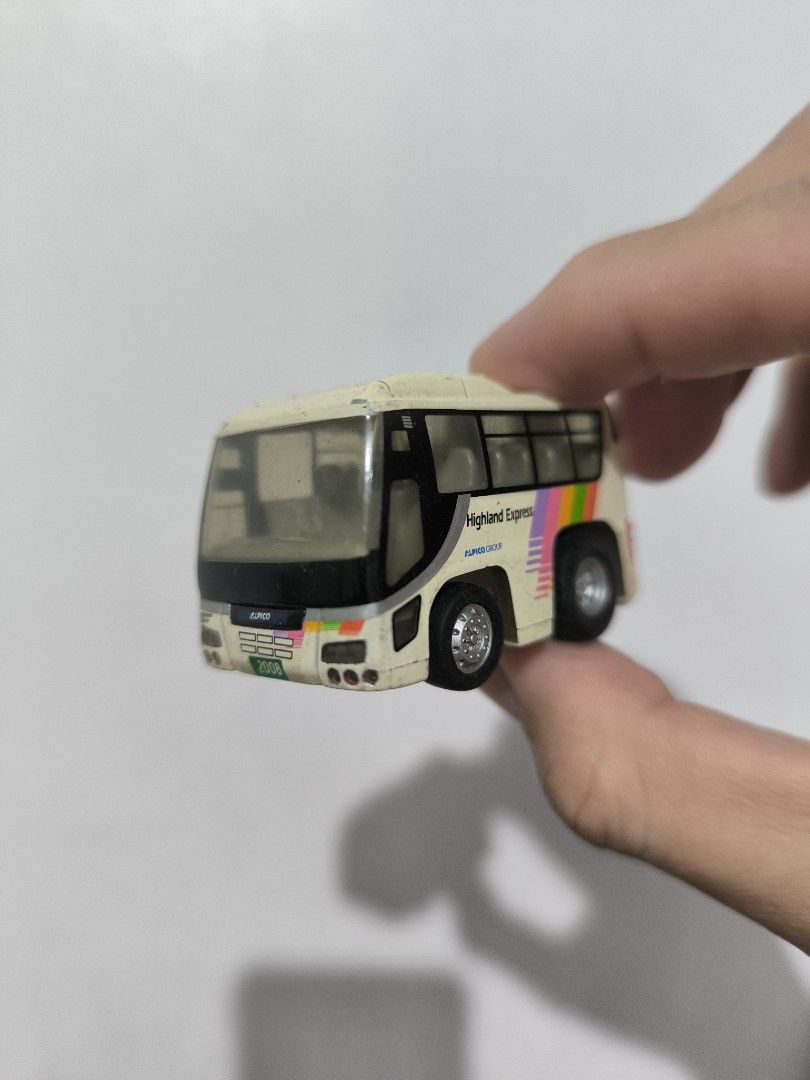 Choro Q High-End Express Bus (Category: Vehicle & Diecast Models) located in Angeles City. Submitted by yellowbrickstore (Listing ID 1428110136, Image 1). Description: Miniature bus toy with a High-End Express design. It features a white body with black windows and colorful stripes. The bus has two axles with wheels. It is a small-sized collectible item. shipping via jnt express Saturday sked only payment Gcash Gotyme pick up AC lnw Pampanga .