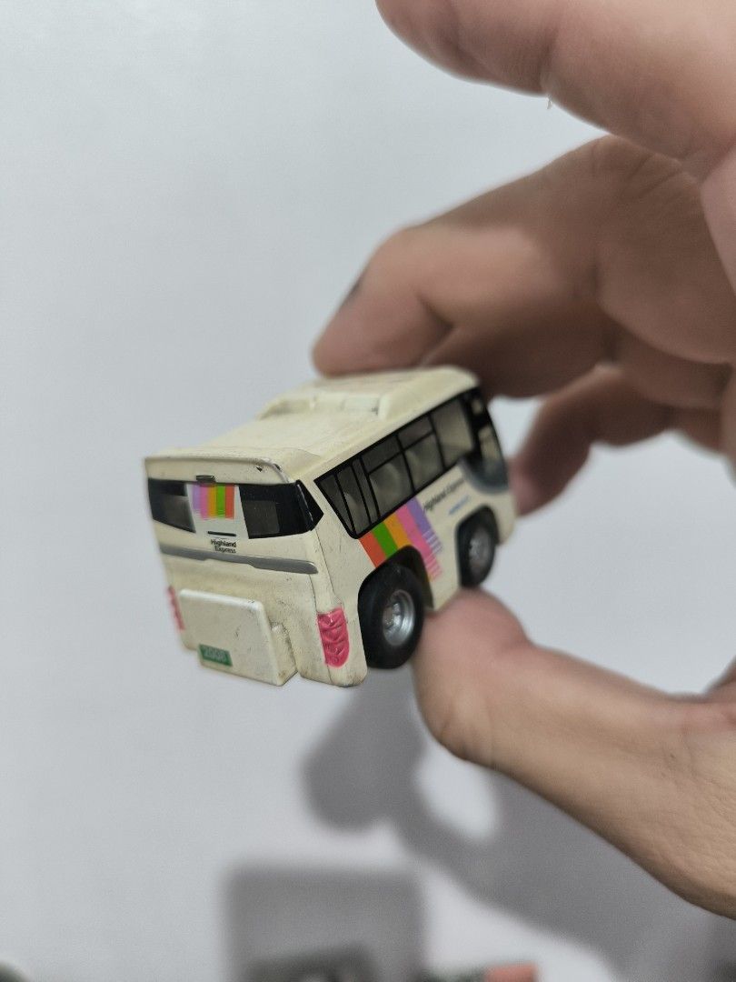 Choro Q High-End Express Bus (Category: Vehicle & Diecast Models) located in Angeles City. Submitted by yellowbrickstore (Listing ID 1428110136, Image 2). Description: Miniature bus toy with a High-End Express design. It features a white body with black windows and colorful stripes. The bus has two axles with wheels. It is a small-sized collectible item. shipping via jnt express Saturday sked only payment Gcash Gotyme pick up AC lnw Pampanga .